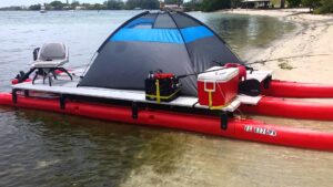 A gray boat tent on a red modular boat system