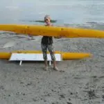 A boat with yellow hulls