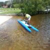 A person on a blue modular pontoon boat