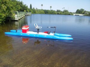 A blue modular kayak with a high seat in the middle