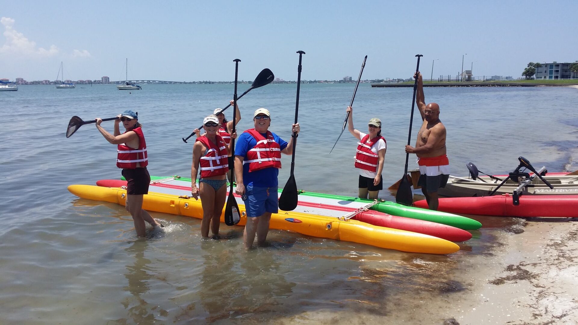 A group of people trying paddle boating