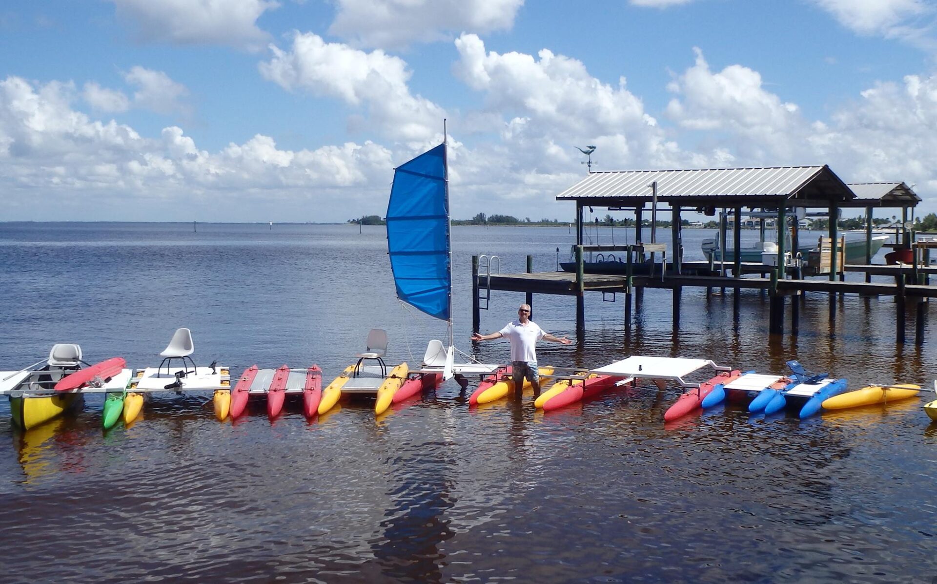 A set of modular canoe boats with colorful outriggers